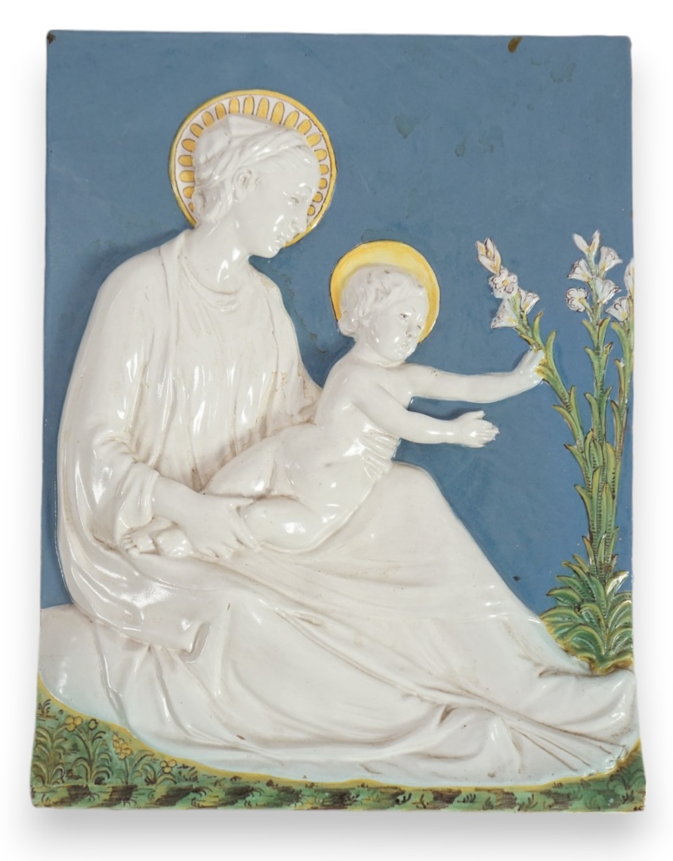 A Cantagalli maiolica wall plaque depicting the Virgin and child, 19th century, after Della Robbia